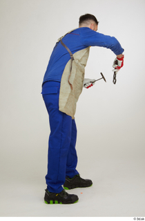  Photos Raul Conley standing whole body working with hammer and pliers 0006.jpg